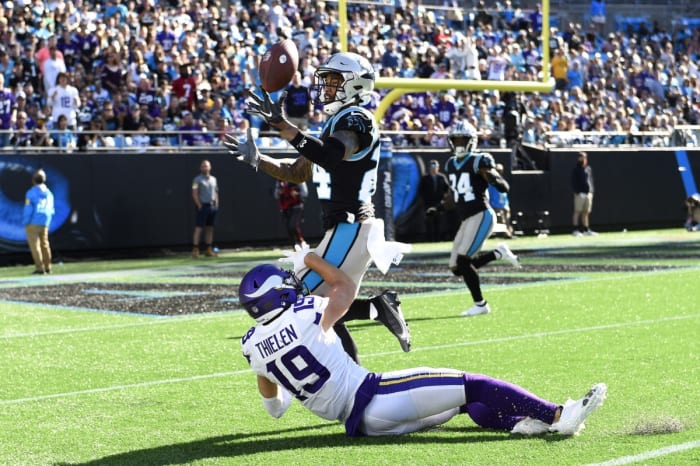 Oct 17, 2021; Charlotte, North Carolina, USA; Carolina Panthers cornerback A.J. Bouye (24) breaks up a pass intended for Minnesota Vikings wide receiver Adam Thielen (19) in the fourth quarter at Bank of America Stadium. Mandatory Credit: Bob Donnan-USA TODAY Sports